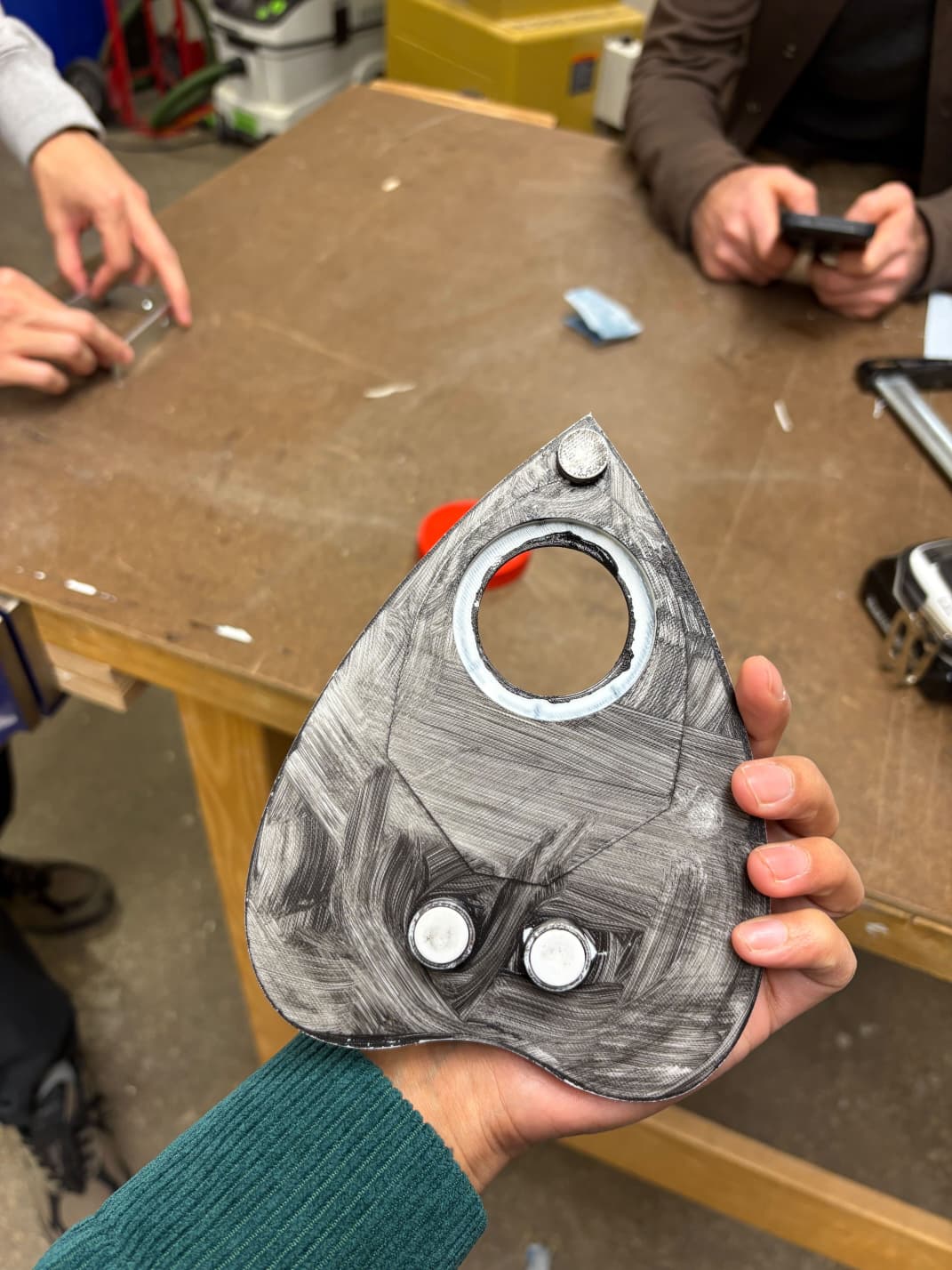 Cursor on table mid-finishing with paint and sponge brush nearby